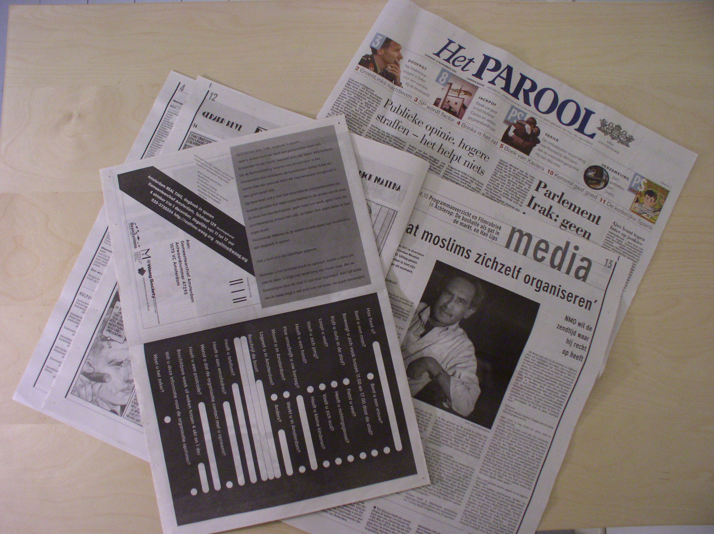 A copy of Het Parool newspaper with the AmsterdamREALTIME registration form
